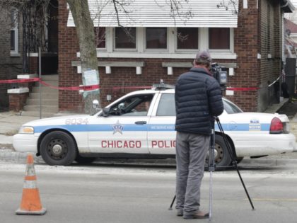 Crime scene tape surrounds a home Friday, Feb. 5, 2016, in Chicago. Chicago police are investigating what led to the deaths of two children, two women and two men whose bodies were found Thursday, with signs of trauma inside the home on the city's South Side. Chicago police Chief of …