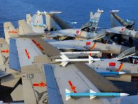 This undated photo taken in April 2018 shows J15 fighter jets on China's sole operational aircraft carrier, the Liaoning, during a drill at sea. - A flotilla of Chinese naval vessels held a "live combat drill" in the East China Sea, state media reported early April 23, 2018, the latest …
