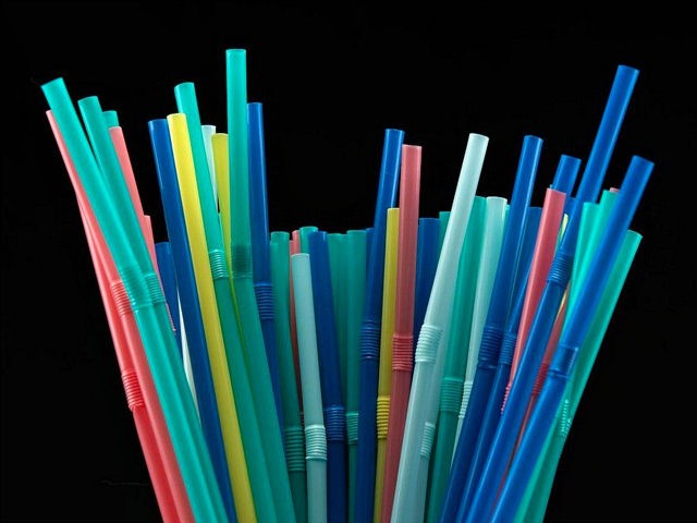 This illustration taken on August 12, 2018, shows plastic straws, in a studio, in Paris. -