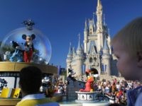 397155 08: Mickey Mouse rides in a parade through Main Street, USA with Cinderella's castle in the background at Disney World's Magic Kingdom November 11, 2001 in Orlando, Florida. (Photo by Joe Raedle/Getty Images)