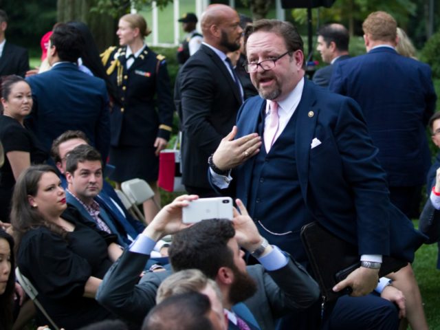 Radio host Sebastian Gorka, who was seated as a guest, moves to confront a journalist afte