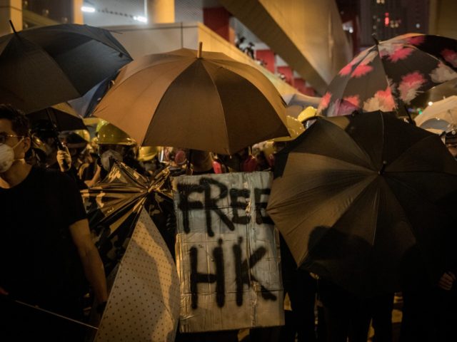 HONG KONG, HONG KONG - JULY 21: Protesters clash with police after taking part in an anti-