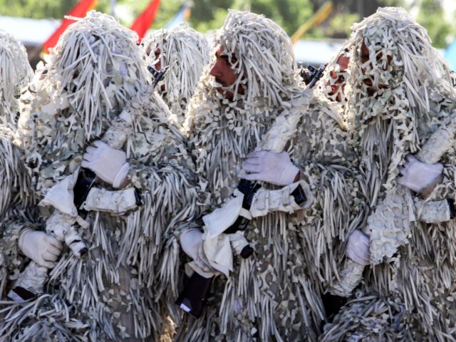 Iranian soldiers march during a parade marking the country's Army Day, on April 18, 2017, in Tehran. / AFP PHOTO / ATTA KENARE (Photo credit should read ATTA KENARE/AFP/Getty Images)