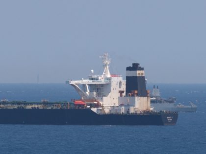 A British Royal Navy ship (back R) patrols near supertanker Grace 1 suspected of carrying crude oil to Syria in violation of EU sanctions after it was detained off the coast of Gibraltar on July 4, 2019. - Authorities did not say where the oil came from but specialised shipping …