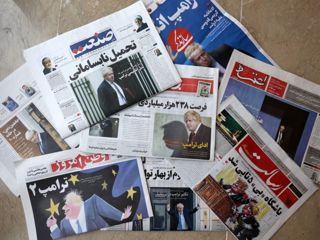 This picture taken on July 24, 2019 shows an assortment of the front pages of Iranian newspapers the following day after the announcement of Boris Johnson winning the race to become Britain's next prime minister, amdist the tense diplomatic stand-off with Iran. - Iranian newspapers gave blanket coverage to news that Boris Johnson would become British PM on July 24, with many comparing him to US President Donald Trump. Dailies across Iran's political spectrum splashed his election to lead the Conservative Party -- propelling him to the office of prime minister -- across their front covers. "British Trump," read the banner of reformist Sazandegi, over a full-page picture of Johnson celebrating his win, and conservative Jaam-e Jam published a picture edited to show Johnson casting a shadow in the shape of Trump's profile on a wall behind him, with the title "Mimicking Trump". (Photo by ATTA KENARE / AFP) (Photo credit should read ATTA KENARE/AFP/Getty Images)