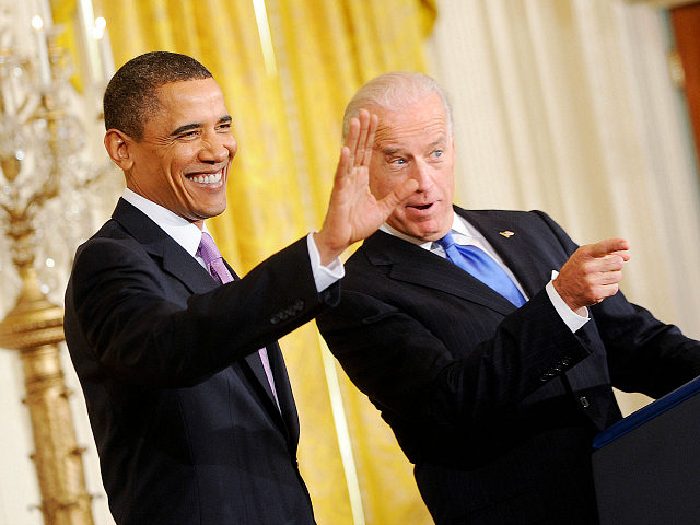 WASHINGTON - JANUARY 21: (AFP OUT) President Barack Obama and Vice President Joe Biden greet the delegation from the U.S. Conference of Mayors in the East Room on January 21, 2010 in Washington, DC. The President and Vice President spoke on building up the economy and producing more jobs in …