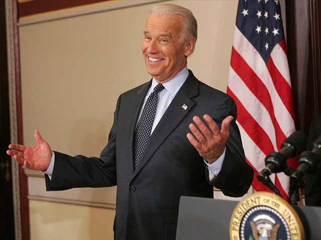 Former Democratic presidential candidate Delaware Senator Joe Biden (L) gestures after being asked to stand behind the presidential podium after US President George W. Bush signed the Second Chance Act of 2007 at the Eisenhower Executive Office Building next to the White House in Washington, DC, on April 9, 2008. …