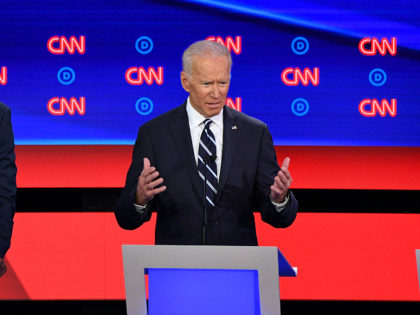 Democratic presidential hopeful Former Vice President Joe Biden (C) gestures as he speaks