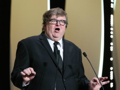 US Michael Moore delivers a speech on stage before awarding the Jury Prize on May 25, 2019
