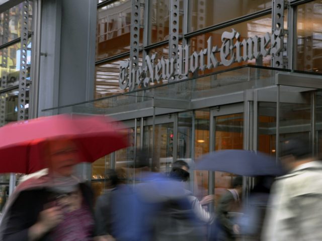 In this Wednesday, Oct. 10, 2012, photo, people pass the New York Times building in New Yo