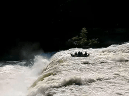 6 people rescued after raft tumbles over waterfall