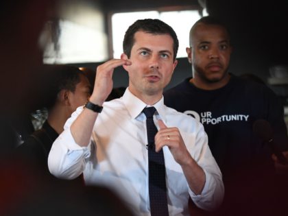 Democratic presidential hopeful and South Bend, Indiana mayor Pete Buttigieg speaks to the media beside David Gross (R) during his tour of the Vector 90 headquarters in South Central Los Angeles, California on July 25, 2019. (Photo by Mark RALSTON / AFP) (Photo credit should read MARK RALSTON/AFP/Getty Images)