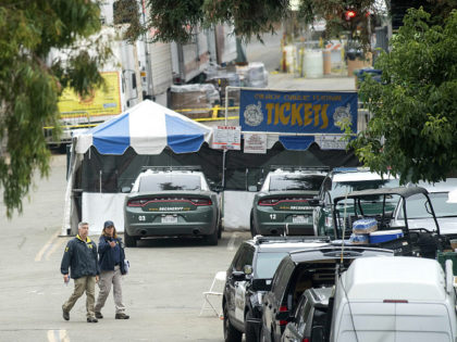 FBI personnel pass a ticket booth at the Gilroy Garlic Festival Monday, July 29, 2019 in Calif., the morning after a gunman killed at least three people, including a 6-year-old boy, and wounding about 15 others. A law enforcement official identified the gunman, who was shot and killed by police, …