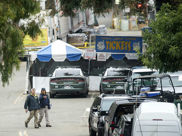 FBI personnel pass a ticket booth at the Gilroy Garlic Festival Monday, July 29, 2019 in C