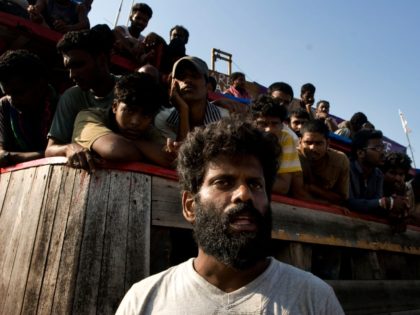 MERAK, JAVA, INDONESIA - OCTOBER 16: Sri Lankan asylum seekers engage in a hunger strike after their boat broke down on the way to Australia's Christmas Island, at Cilegon on October 16, 2009 in Merak, Java, Indonesia. Around 260 asylum seekers set off from Malaysia on a large cargo boat …