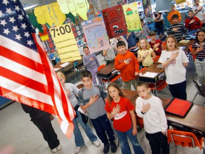 WARMINSTER, PA - MARCH 24: Fourth graders at Longstreth Elementary School pledge allegiance to the flag March 24, 2004 in Warminster, Pennsylvania. An atheist parent, Michael Newdow, of Sacramento, California is scheduled to be heard by the Supreme Court today to defend his position that the "Under God" in the …