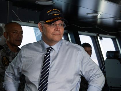 Prime Minister of Australia, the Hon Scott Morrison, MP, is shown the bridge of HMAS Adelaide by Commanding Officer, Captain Jonathan Earley, CSC, RAN, during a visit to personnel deployed in support of APEC in Port Moresby, Papua New Guinea, onboard Royal Australian Navy amphibious ship, HMAS Adelaide.