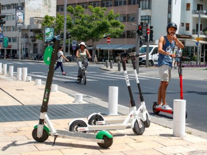 A man rides an electric scooter in the streets of the Israeli coastal town of Tel Aviv on May 30, 2019. - Israelis in the countrys economic capital Tel Aviv have embraced electric scooters and their smart-phone rental systems, using them to zip along Mediterranean beaches and avoid heavy traffic …