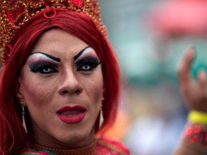 A drag queen poses for the picture during the Gay Pride Parade at Copacabana beach in Rio