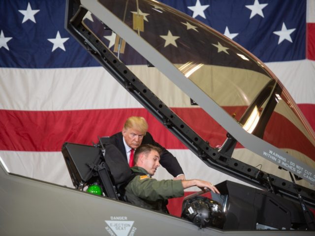 US President Donald Trump speaks with F-35 fighter plane pilot Lt Col Jason Curtis as he t