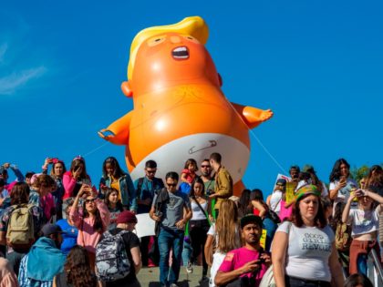 A satirical balloon of a baby Donald Trump is seen during the Third Annual Women's March L