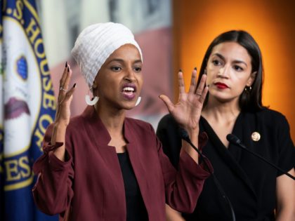 U.S. Rep. Ilhan Omar, D-Minn., left, joined at right by U.S. Rep. Alexandria Ocasio-Cortez, D-N.Y., responds to base remarks by President Donald Trump after he called for four Democratic congresswomen of color to go back to their "broken" countries, as he exploited the nation's glaring racial divisions once again for …