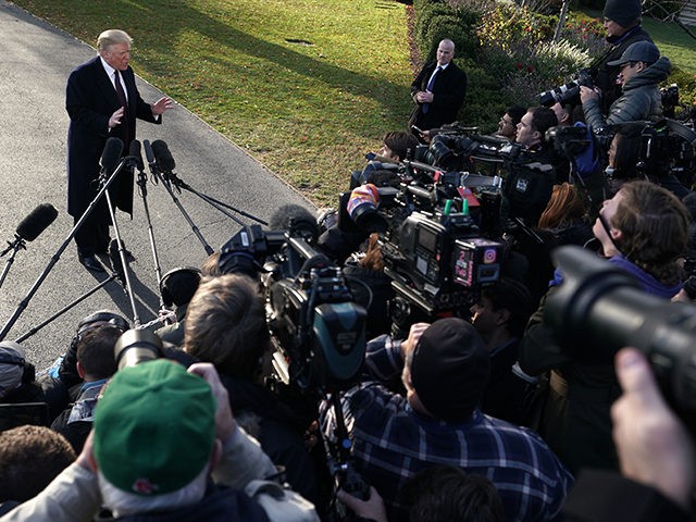 WASHINGTON, DC - NOVEMBER 20: U.S. President Donald Trump speaks to members of the media prior to his departure from the White House November 20, 2018 in Washington, DC. President Trump is traveling to his Mar-a-Lago resort in Palm Beach, Florida, for the Thanksgiving holiday. (Photo by Alex Wong/Getty Images)