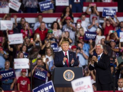 GREENVILLE, NC - JULY 17: President Donald Trump takes the podium before speaking during a Keep America Great rally on July 17, 2019 in Greenville, North Carolina. At right is Mike Pence, U.S. Vice President. Trump is speaking in North Carolina only hours after The House of Representatives voted down …