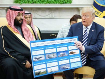 TOPSHOT - US President Donald Trump (R) holds a defence sales chart with Saudi Arabia's Crown Prince Mohammed bin Salman in the Oval Office of the White House on March 20, 2018 in Washington, DC. (Photo by MANDEL NGAN / AFP) (Photo credit should read MANDEL NGAN/AFP/Getty Images)