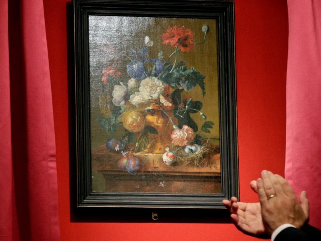 The "Vase of Flowers" painting by Jan van Huysum, is unveiled during a ceremony at the Pit