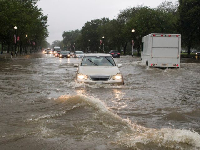 Heavy rainfall flooded the intersection of 15th Street and Constitution Ave., NW, stalling