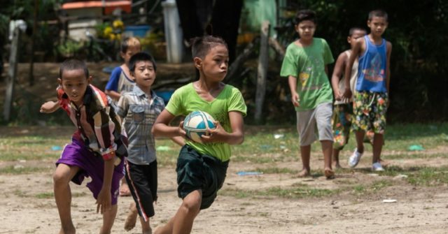 Dung and Dragons: Myanmar kids dodge cows to play rugby - Breitbart