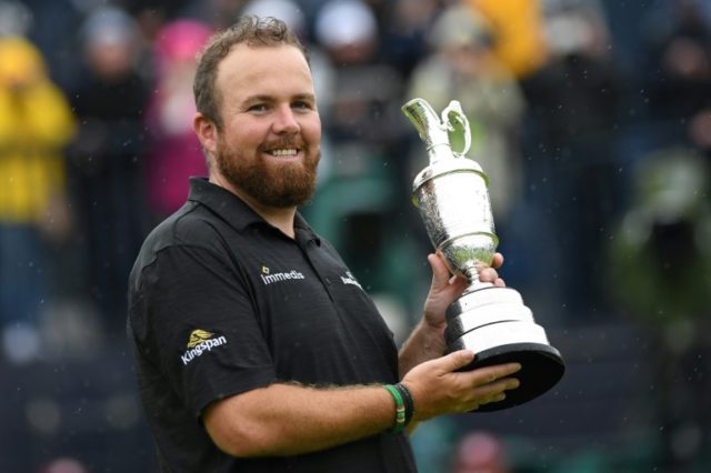 Lowry weathers storm to win British Open and first major