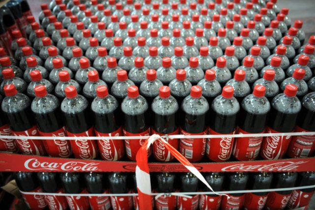 Shares of Coca-Cola rose early Tuesday after the company lifted some of its profit targets Coca-Cola profits up on strong North America
