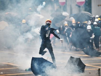 Police fire tear gas, rubber bullets at Hong Kongers protesting 'triad' attack