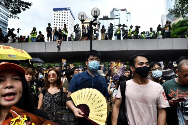 Hong Kong protesters defy police ban and march again