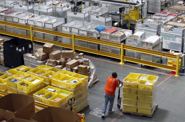 Amazon Training In this Aug. 3, 2017, file photo, a worker pushes bins at an Amazon fulfillment center in Baltimore. Amazon will spend more than $700 million to provide additional training to about one third of its U.S. workforce. (AP Photo/Patrick Semansky, File) The Associated Press