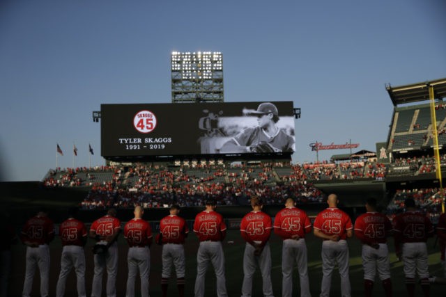 Mariners Angels Baseball Members of the Los Angeles Angels observe a moment of silence for teammate Tyler Skaggs, before a baseball game against the Seattle Mariners on Friday, July 12, 2019, in Anaheim, Calif. (AP Photo/Marcio Jose Sanchez) The Associated Press