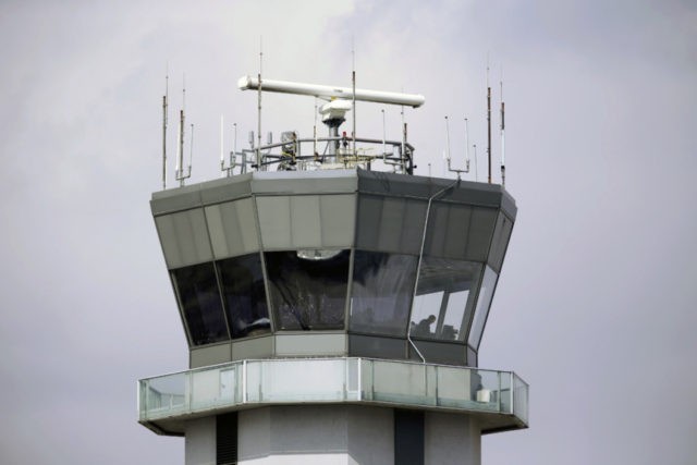 Aviation Security Warning This March 12, 2013 photo shows the air traffic control tower at Chicago's Midway International Airport. The Department of Homeland Security plans to issue a security alert Tuesday for small planes, warning that modern flight systems are vulnerable to hacking if someone manages to gain physical access to the aircraft. A DHS alert recommends that plane owners ensure they restrict unauthorized physical access to their aircraft until the industry develops safeguards to address the issue, which was discovered by Boston based cybersecurity company, Rapid7, and reported to the federal government. (AP Photo/M. Spencer Green) The Associated Press