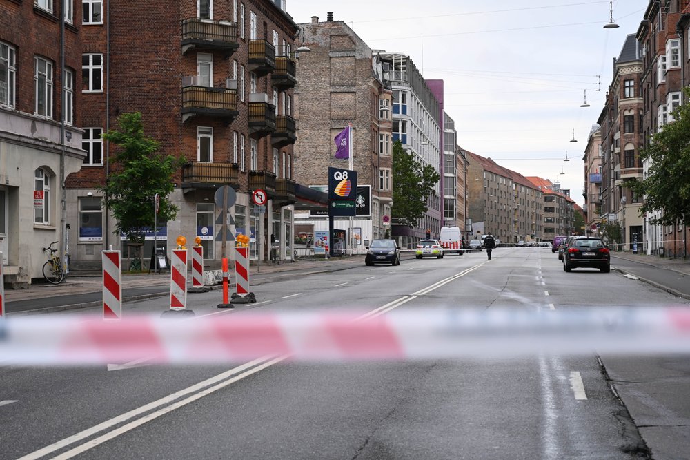 Danish police block a road in a neighborhood of Copenhagen, Saturday, Aug. 10, 2019 after a nearby local police station was hit by an explosion early in the morning. This follows-on from Tuesday's explosion which occurred outside the Danish Tax Agency's office in Copenhagen. (Philip Davali/Ritzau Scanpix via AP)