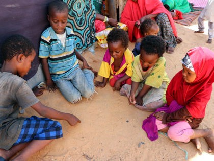 Newly arrived children fleeing from the drought affected areas in the Lower Shabelle Region draw on the sand at al-Adala Internally displaced people (IDP) Camp just outside of the Somali capital Mogadishu on May 15, 2019. - Drought has left nearly two million Somalis in desperate need of food, Norwegian …