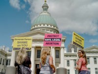 ST LOUIS, MO - MAY 30: Jessica Piper, Veronica Hupp, and Ashlee Hendrix stand in front of Luther Ely Smith Park before a rally to protest the closure of the last abortion clinic in Missouri on May 30, 2019 in St Louis, Missouri. In the wake of Missouri recent controversial …