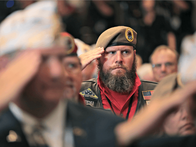 LOUISVILLE, KENTUCKY - AUGUST 21: Veterans salute for the presentation of colors during the Joint Opening Ceremony at the American Veterans (AMVETS) 75th National Convention at the Galt House where President Donald Trump is expected address the members on August 21, 2019 in Louisville, Kentucky. AMVETS is a non-partisan, volunteer-led …