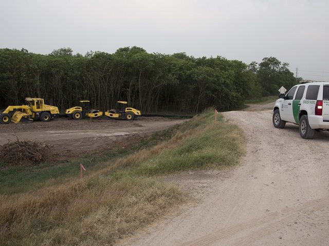 In this April 29, 2019, photo, construction equipment sets in an area of demolished trees and brush where construction is set to begin soon, in Mission , Texas. The cleared area included a mix of trees, including mesquite, mulberry and hackberry, used to protect birds during the ongoing nesting season. …