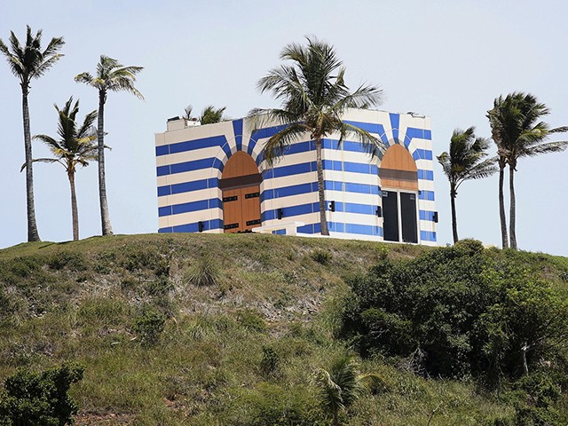 A blue-striped structure sits on a lookout point on Little St. James Island, in the U. S. Virgin Islands, a property owned by Jeffrey Epstein, Wednesday, Aug. 14, 2019. Epstein bought Little St. James Island more than two decades ago and built a stone mansion with cream-colored walls on one end of it. Surrounding it are several other structures including the maids’ quarters and the huge, square-shaped, blue-striped building on the other end of the island that workers told each other was a music room fitted with a grand piano and acoustic walls. (AP Photo/Gabriel Lopez Albarran)