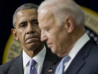 President Barack Obama listens to Vice President Joe Biden make remarks before signing the 21st Century Cures Act, Tuesday, Dec. 13, 2016, in the South Court Auditorium in the Eisenhower Executive Office Building on the White House complex in Washington. (AP Photo/Pablo Martinez Monsivais)