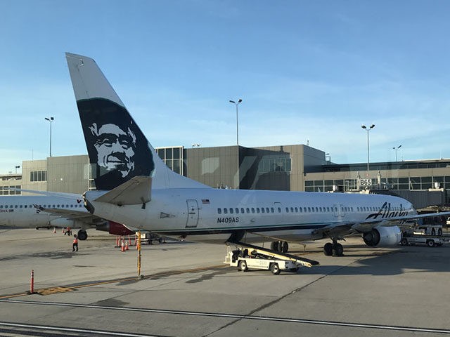 An Alaska Airline jet is parked at a gate at Dulles international Airport on June 16, 2018