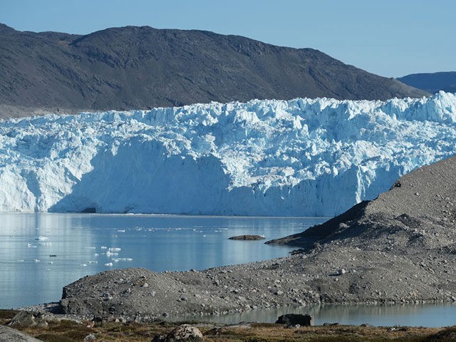 EQIP SERMIA, GREENLAND - AUGUST 01: The Eqip Sermia Glacier, also called the Eqi Glacier, is seen behind a moraine left exposed by the glacier's retreat during unseasonably warm weather on August 01, 2019 at Eqip Sermia, Greenland. Eqip Sermia is located approximately 350km north of the Arctic Circle, and …