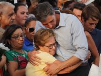 EL PASO, TEXAS - AUGUST 07: Democratic presidential candidate and former Rep. Beto O’Rourke (D-TX) (C-R) hugs a woman at a makeshift memorial outside Walmart honoring victims of a mass shooting there which left 22 people dead, on August 7, 2019 in El Paso, Texas. President Donald Trump visited the …