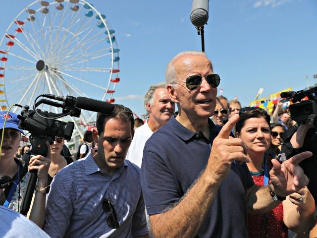 DES MOINES, IOWA - AUGUST 08: Democratic presidential candidate and former Vice President Joe Biden is surrounded by journalists as he heads for the exits at the Iowa State Fair August 08, 2019 in Des Moines, Iowa. 22 of the 23 politicians seeking the Democratic Party presidential nomination will be …
